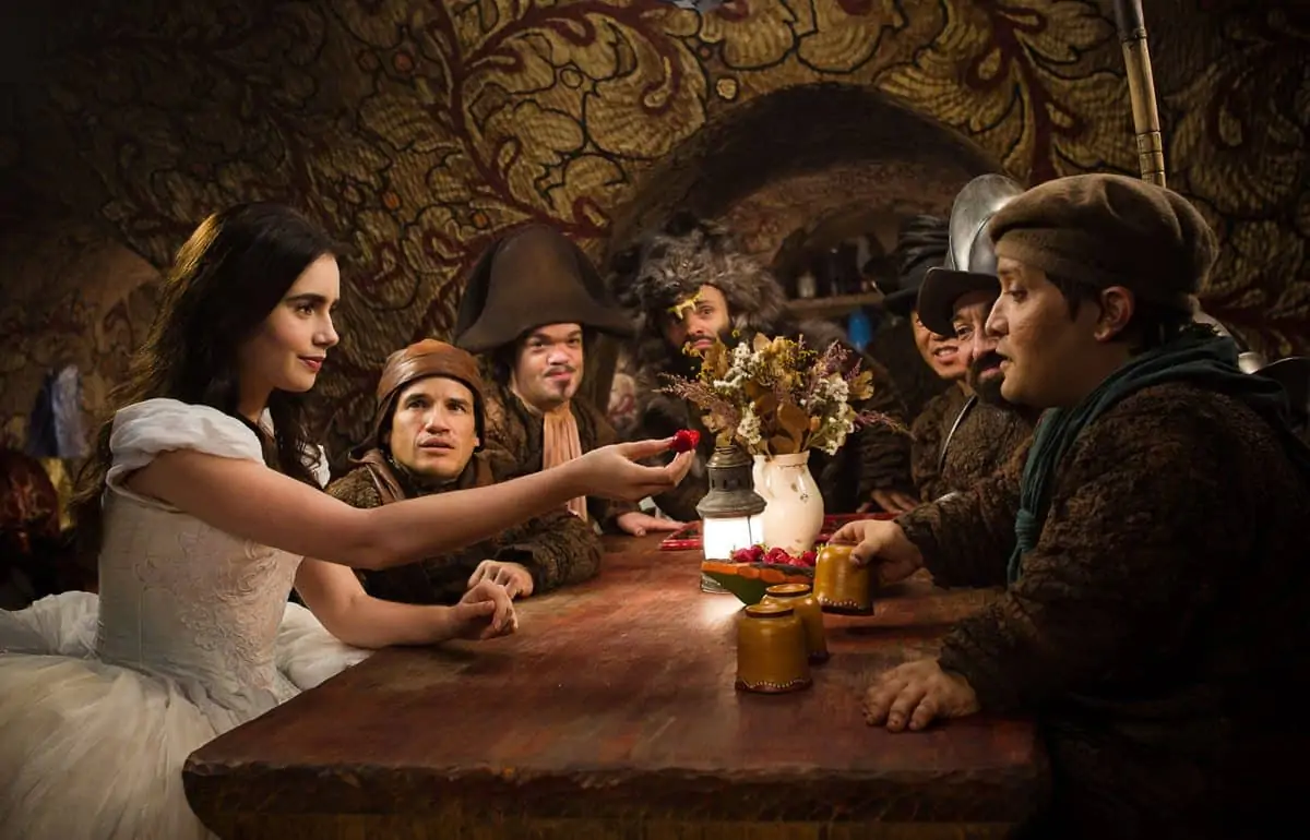 Lily Collins as Snow White with Mark Provinelli, Jordan Prentice, Sabastian Saraceno, Ronald Lee Clark, Danny Woodburn and Joey Gnoffo as the Seven Dwarfs