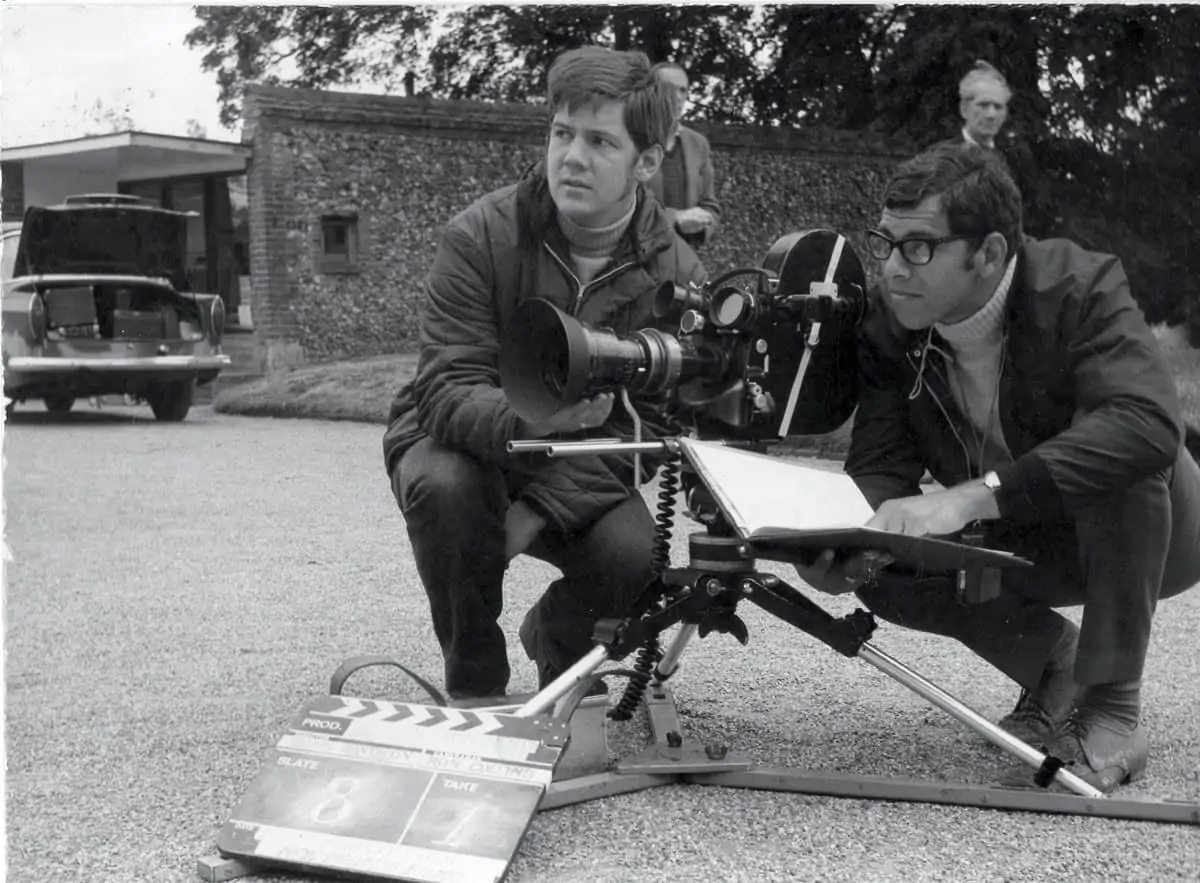 On location ... Ron Collins, wearing glasses, with assistant cameraman Michael Anderson on a shoot in Norfolk in 1962