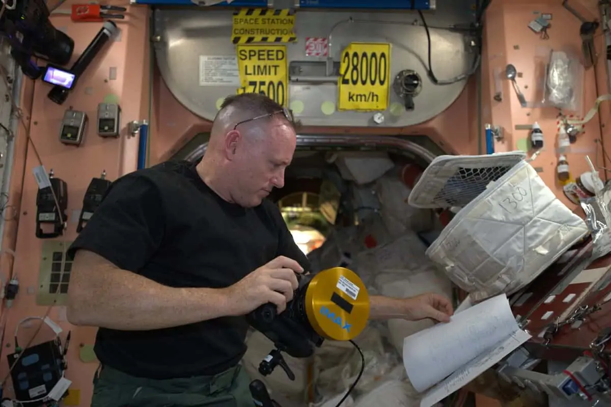 In orbit... Butch Wilmore with the IMAX Canon 1DC preparing for a shot aboard the ISS