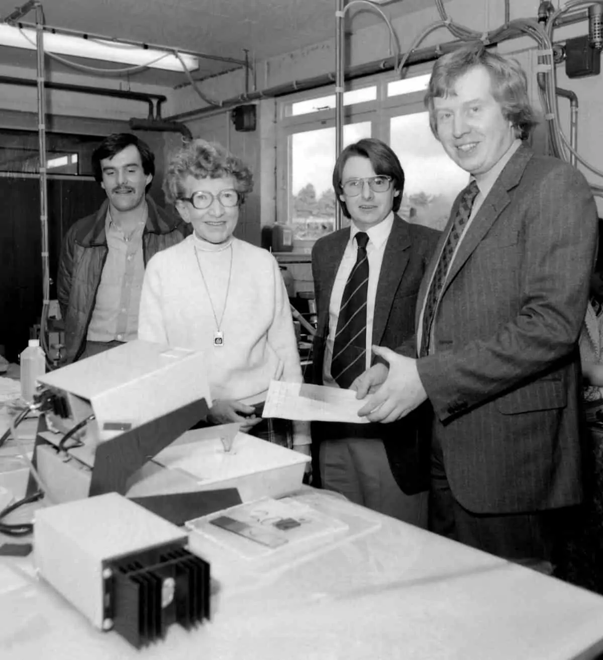 Ralph Young and Eddie Ruffell discuss the new computerised admin system with Doris, who ran the filter department for many years