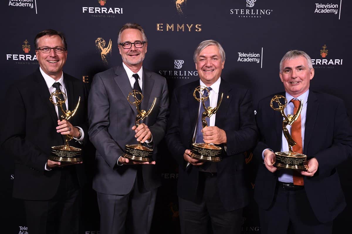 Rick Dempsey, from left, Jeff Miller, Brian Sanders, and Andy Aherne pose with the Engineering Emmy Award for Disney Global Localization
