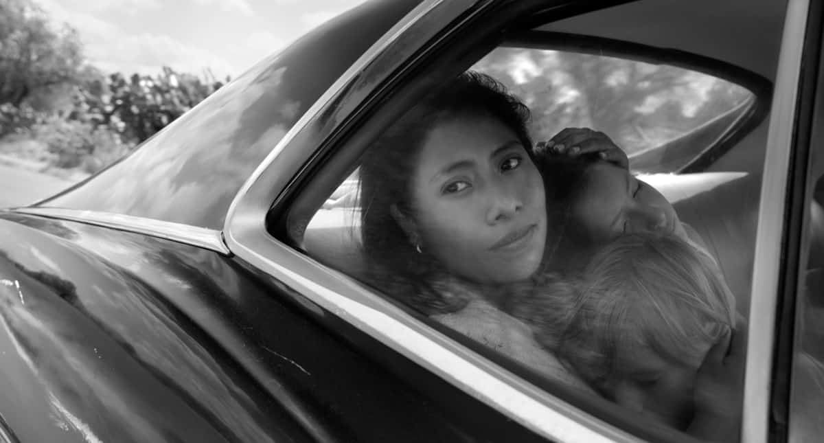 ROMA Yalitza Aparicio as Cleo, Marco Graf as Pepe, and Daniela Demesa as Sofi. Image by Alfonso Cuarón.