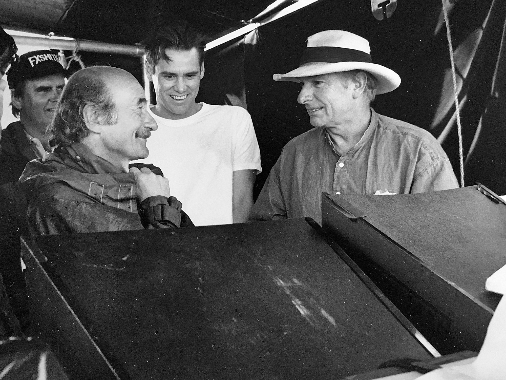 Peter Biziou (left), Jim Carrey (centre) and director Peter Weir (right) watching playback on <em>The Truman Show</em>