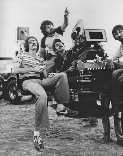 On the set of <em>Escape From New York</em>: Dean Cundey ASC points out a detail to (from left) director John Carpenter, camera operator Ray Stella, gaffer Mark Walthour and 1st AC Clyde Bryan
