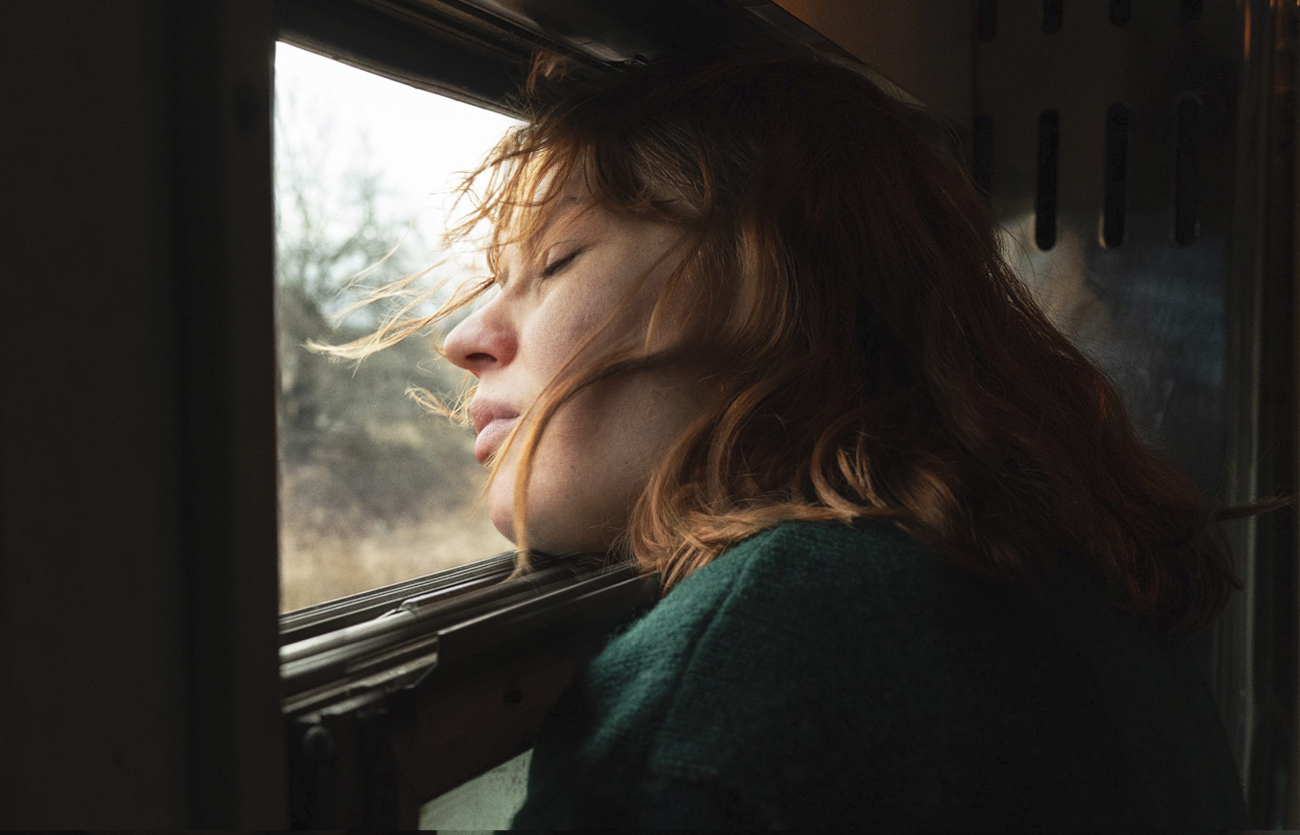 A woman leaning out of a window