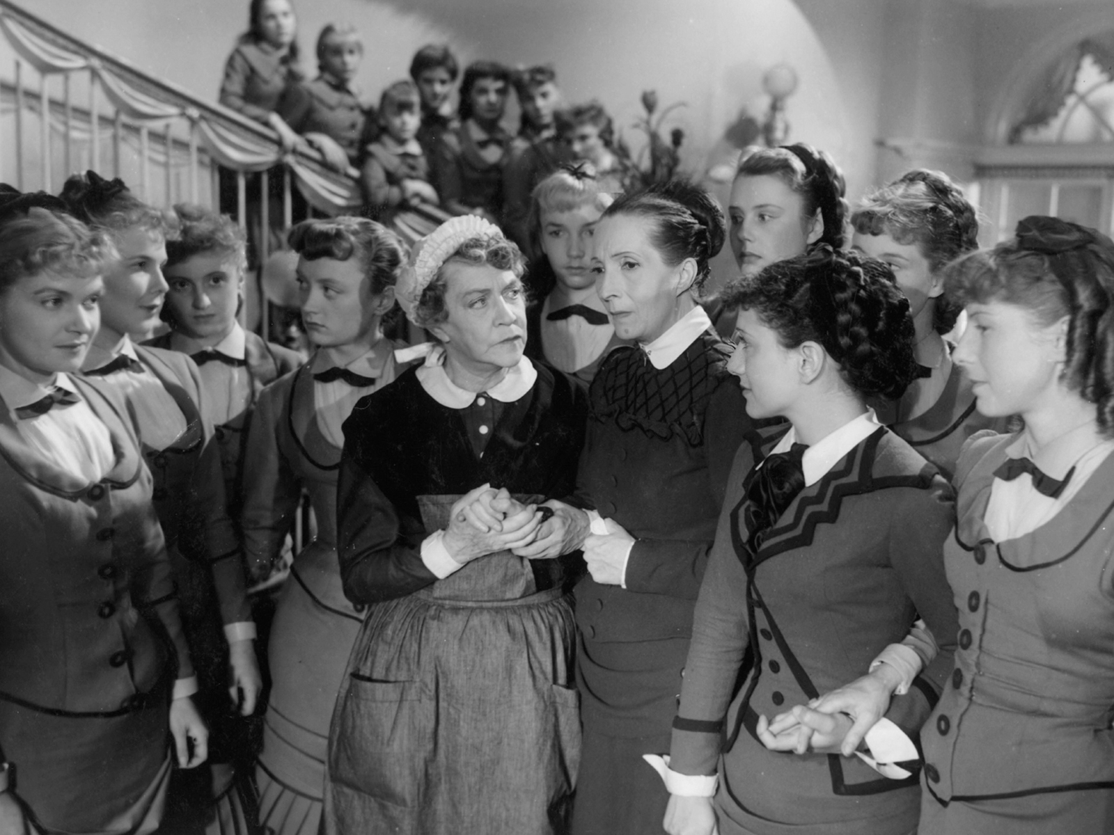 A still from Olivia showing women gathered together