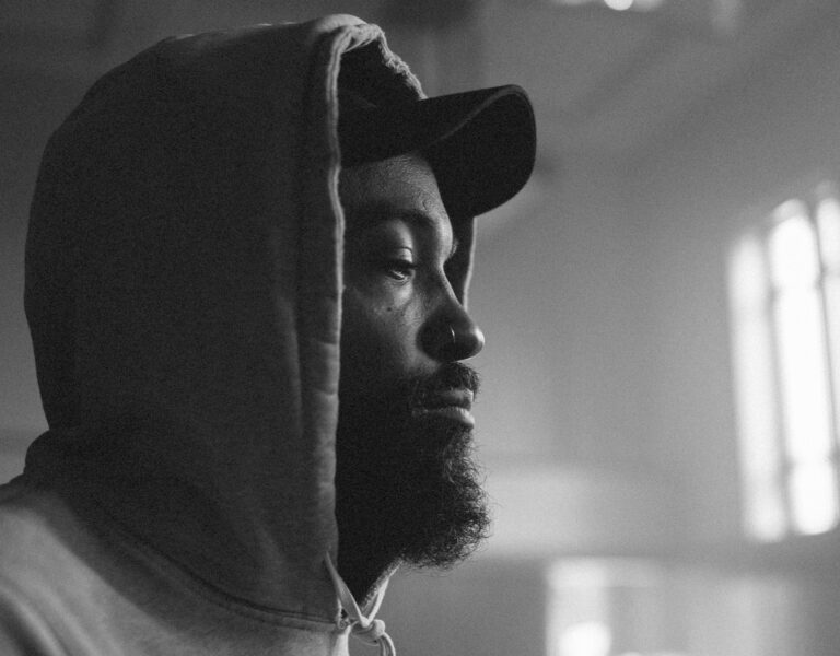 Bradford Young ASC in a hoodie and cap
