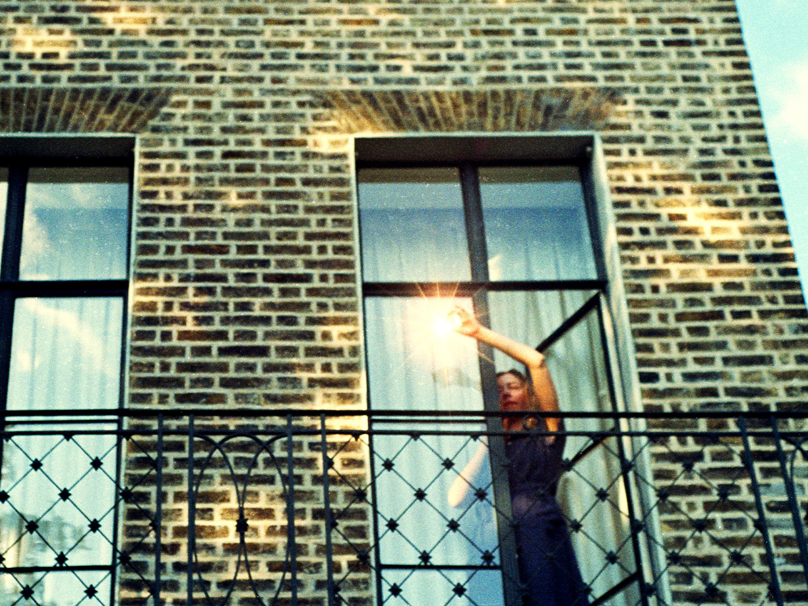 A woman leaning out of a window