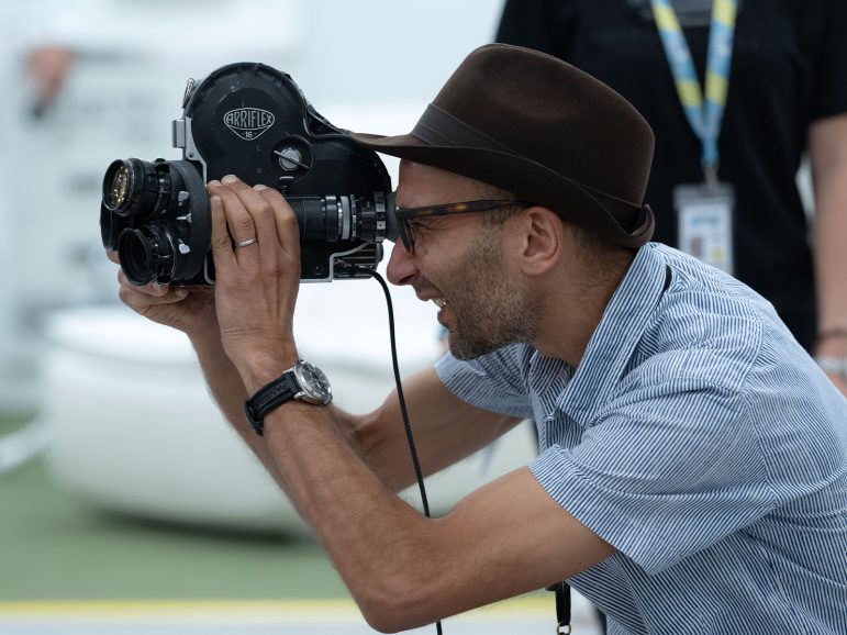 A person looking through a camera