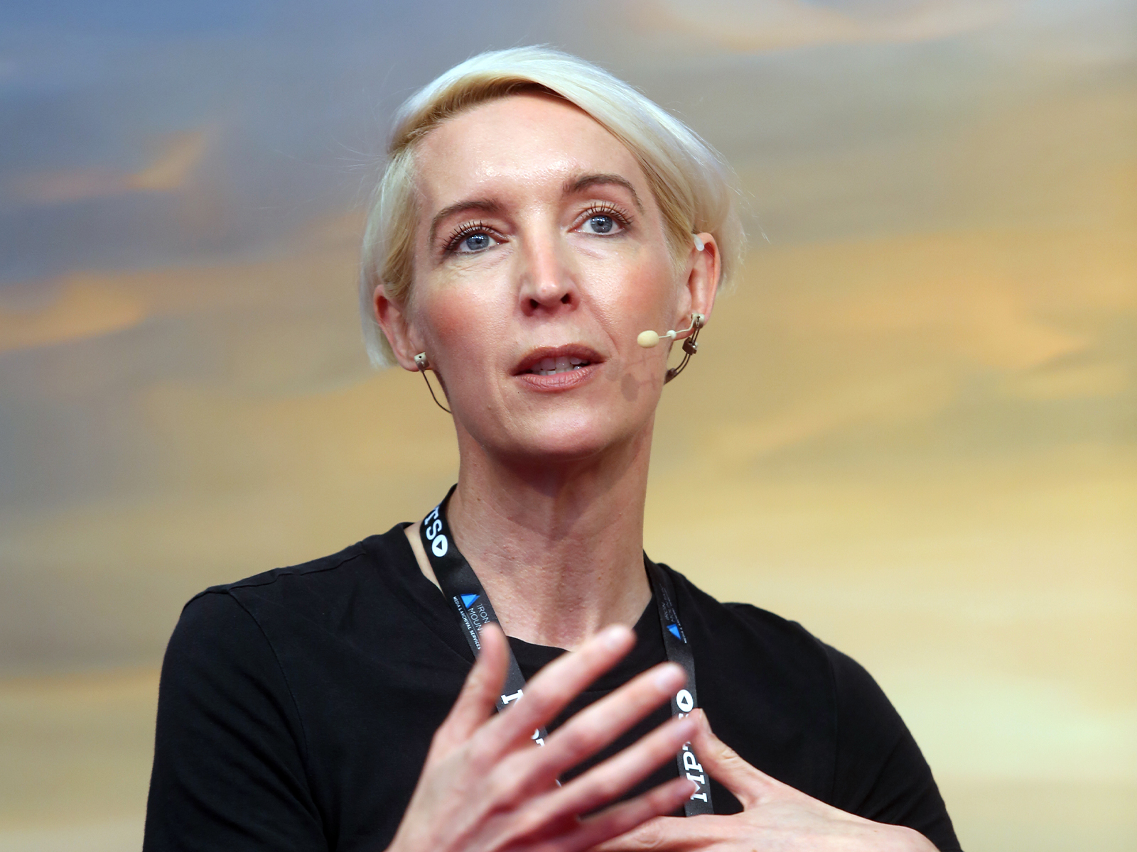 A woman talking on stage