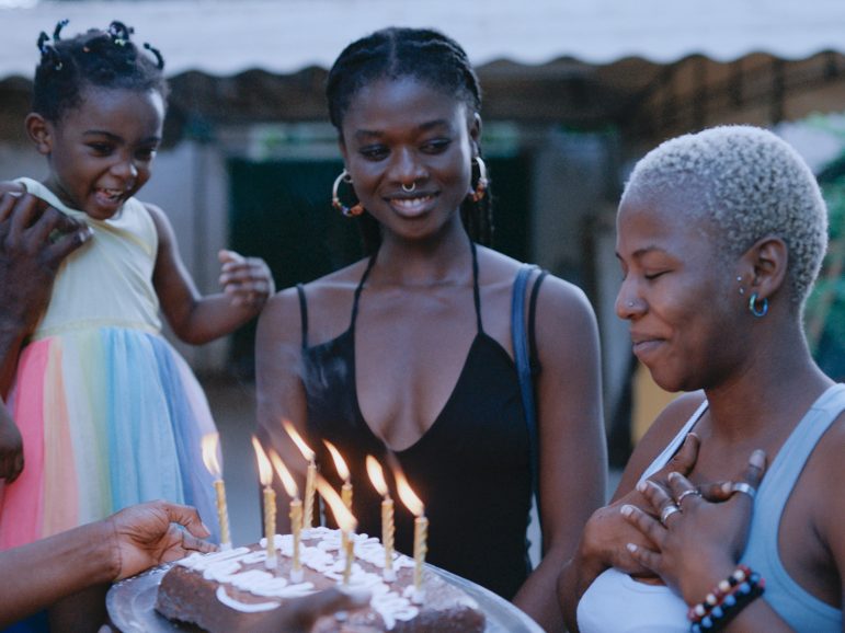 People gathered around a cake
