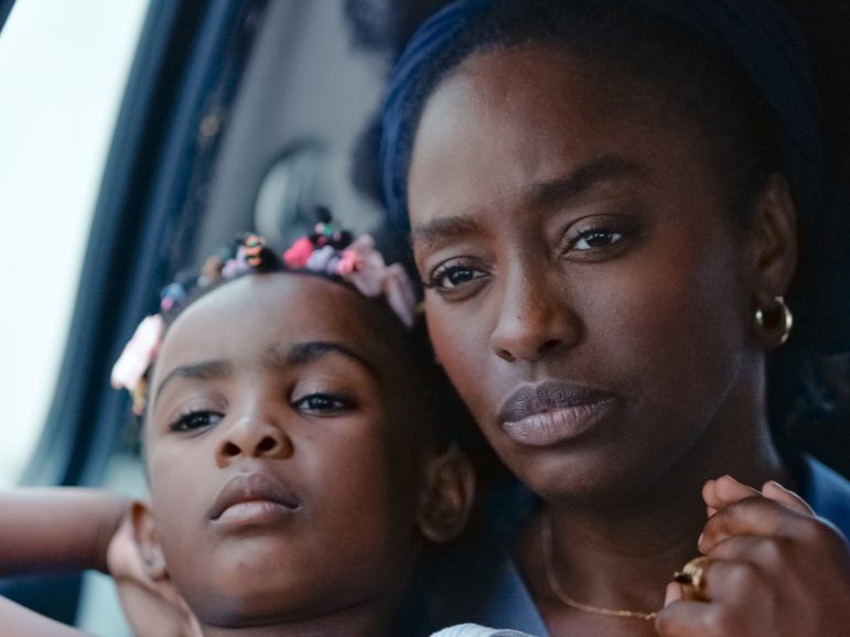 An adult and child sat together