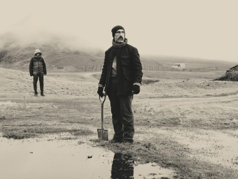 Two people stood in a field