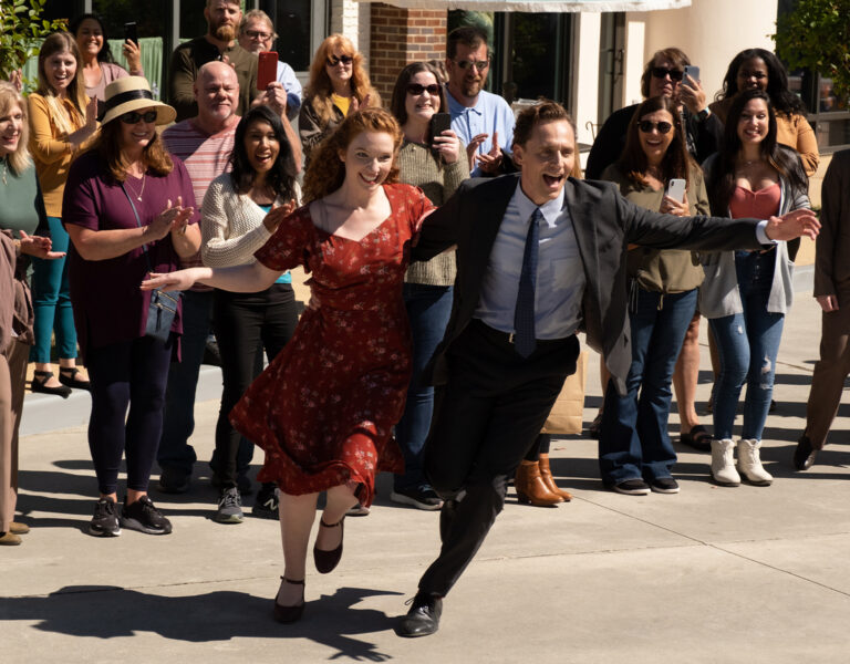 People dancing in front of a crowd