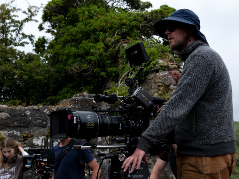 A person operating a camera