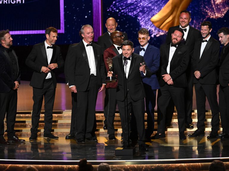 People on stage accepting an award