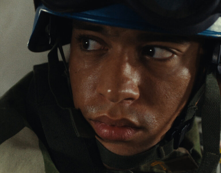 A soldier sat looking tense