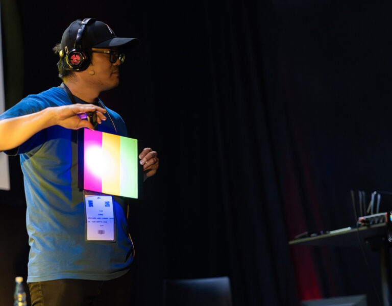 A man holding a light board