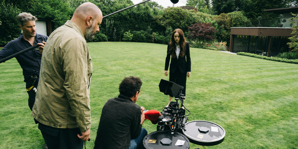 Film crew shooting in a garden