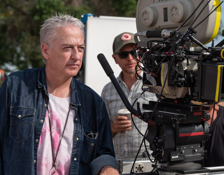 Seamus McGarvey on set looking intense behind a camera