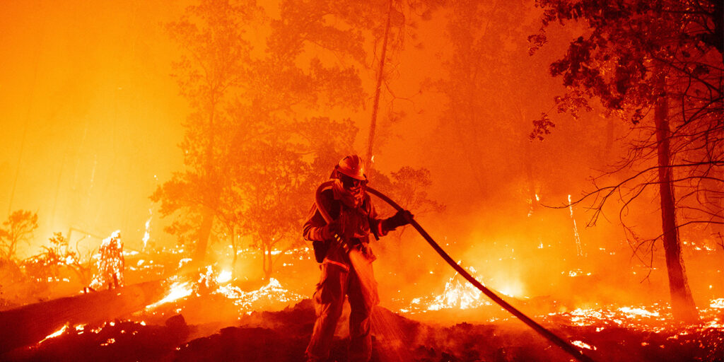 A firefighter in a blazing inferno