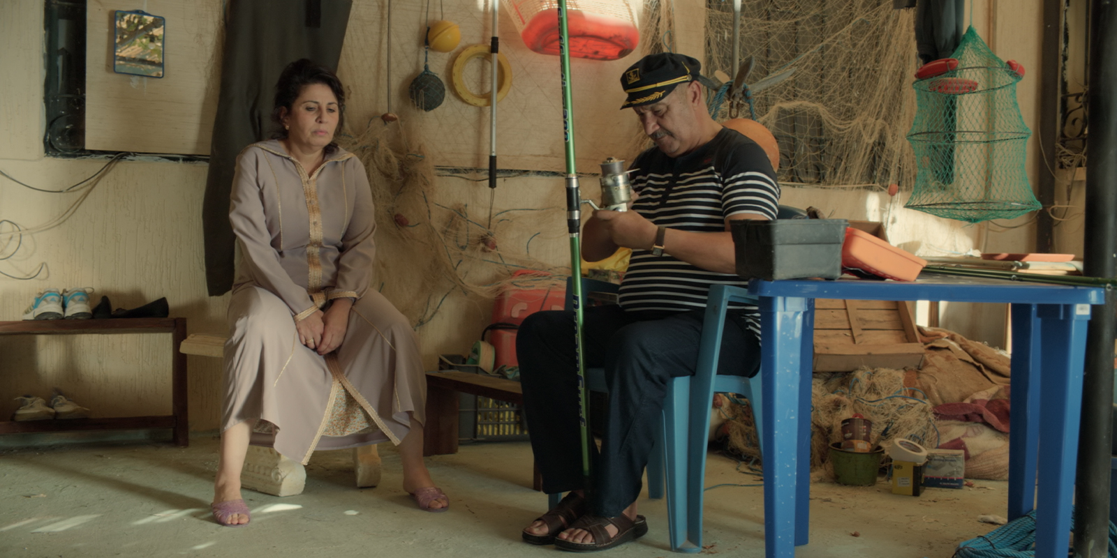Two people sat together looking tense