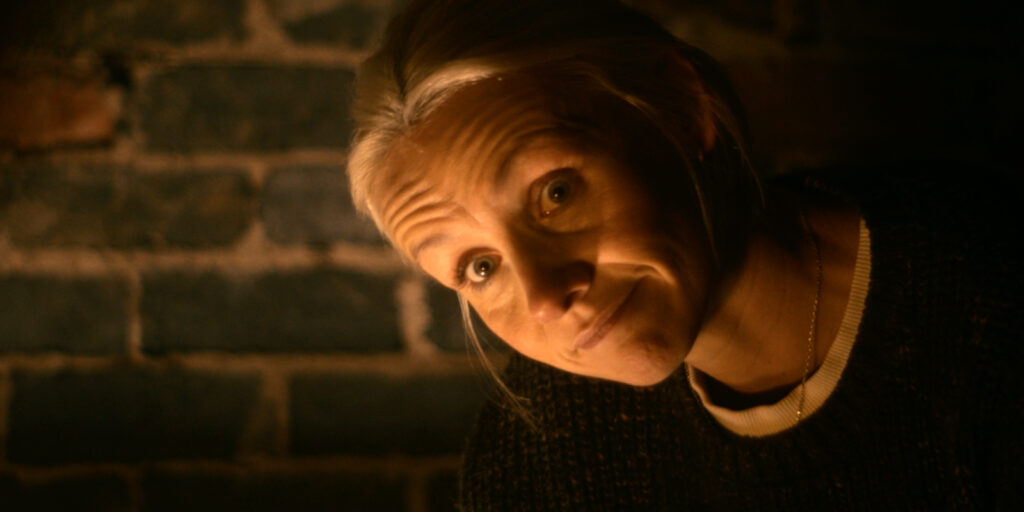 A woman leaning and smiling