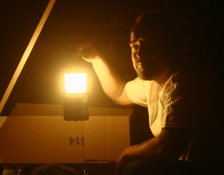 Ryan Davies holding a torch