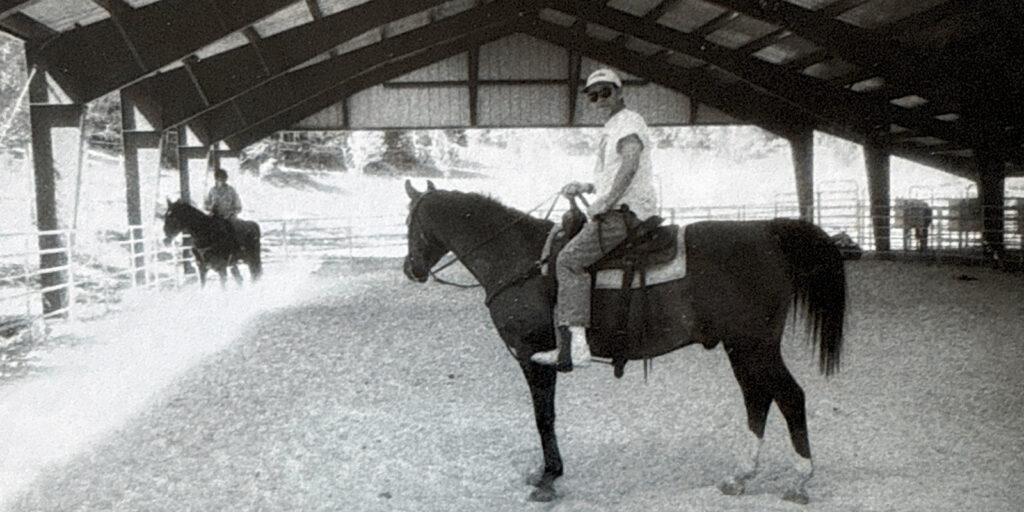 A man on a horse in a ranch
