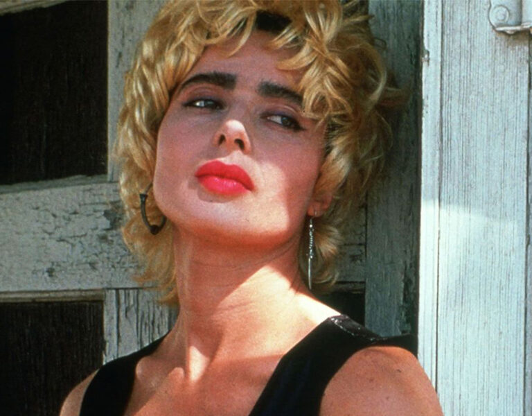 A woman in red lipstick