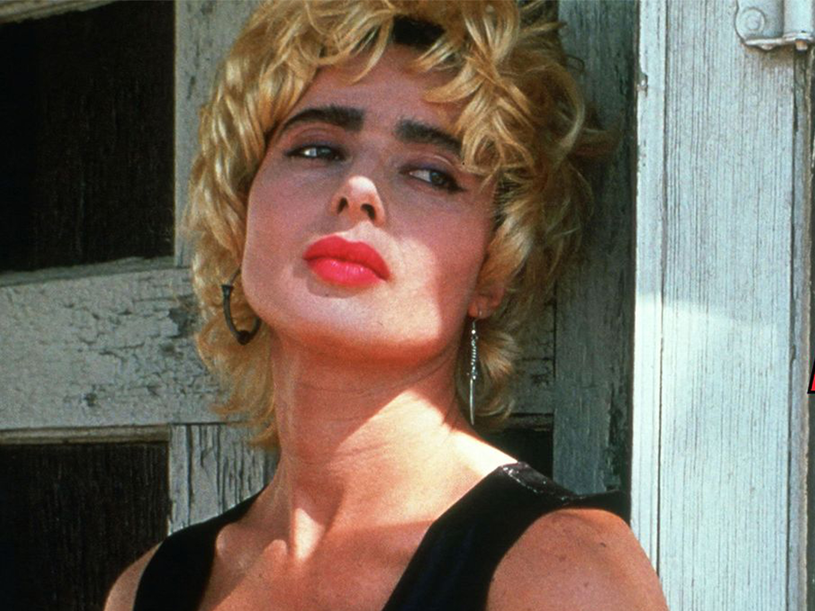 A woman in red lipstick