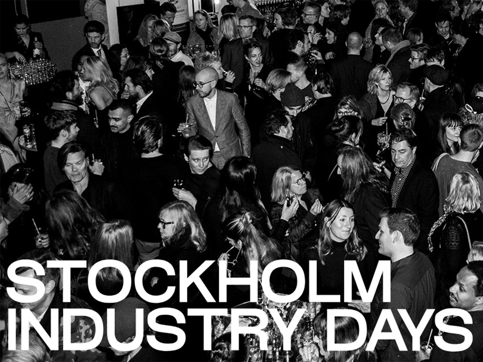 A crowd of people with the words "Stockholm Industry Days" in front of them