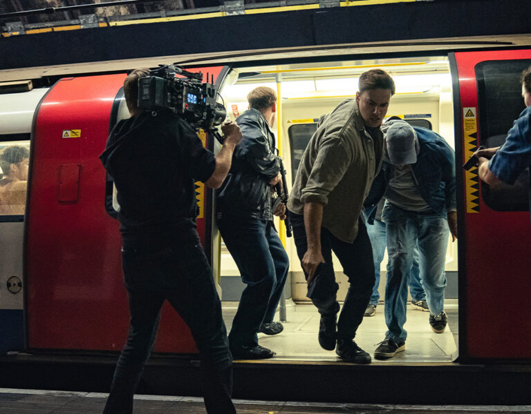 Film crew by a tube