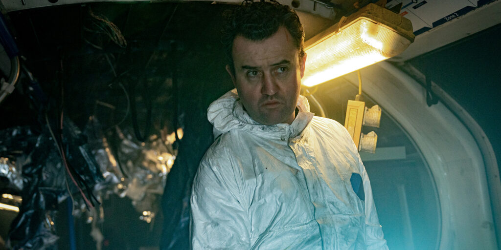 A man in a silver outfit