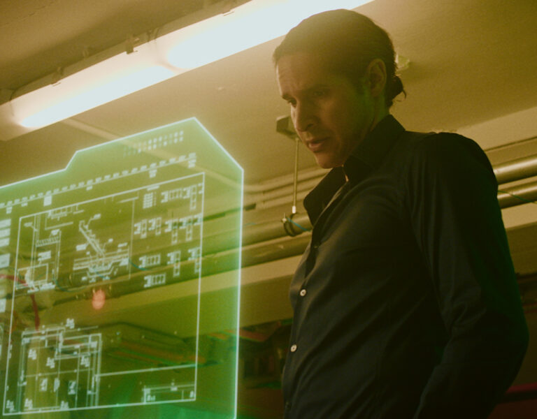 A man looking at a digital screen