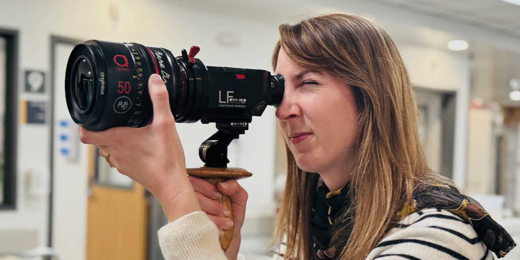 Joanna Coelho holding a camera