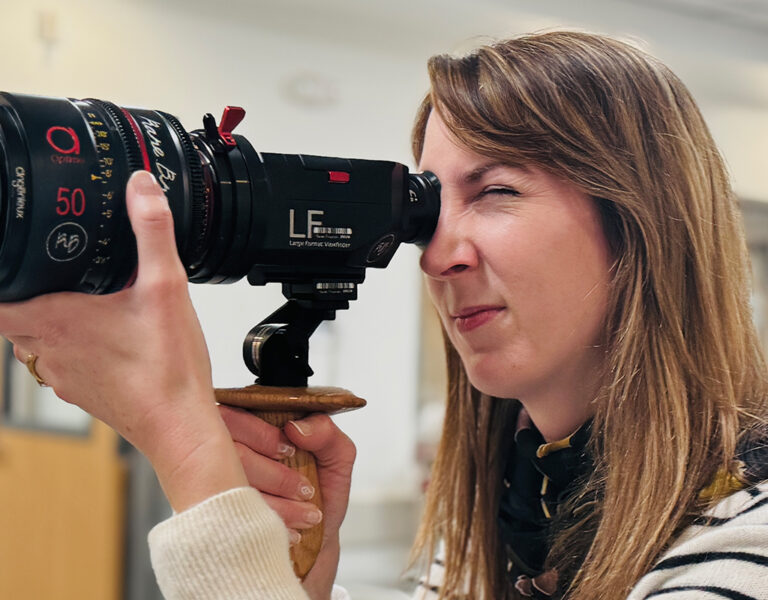 Joanna Coelho holding a camera