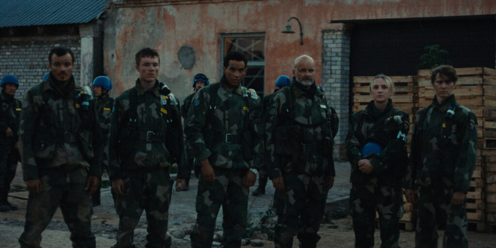 A group of soldiers looking into camera