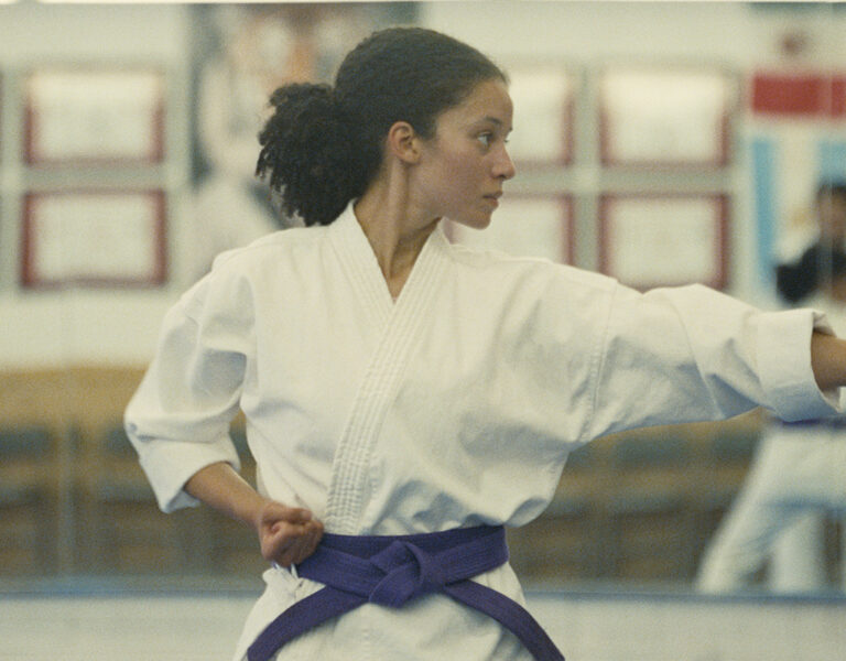 Chase Infiniti in karate gear throwing a punch