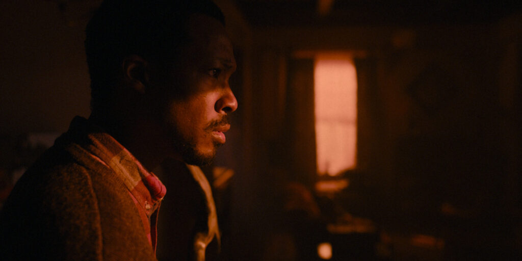 A man in a shadowy environment 