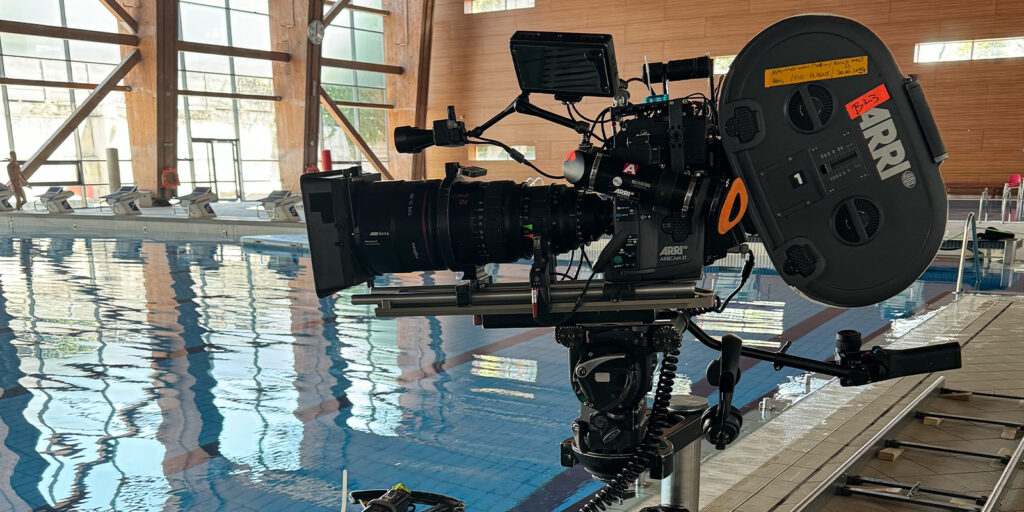 A large camera by a swimming pool