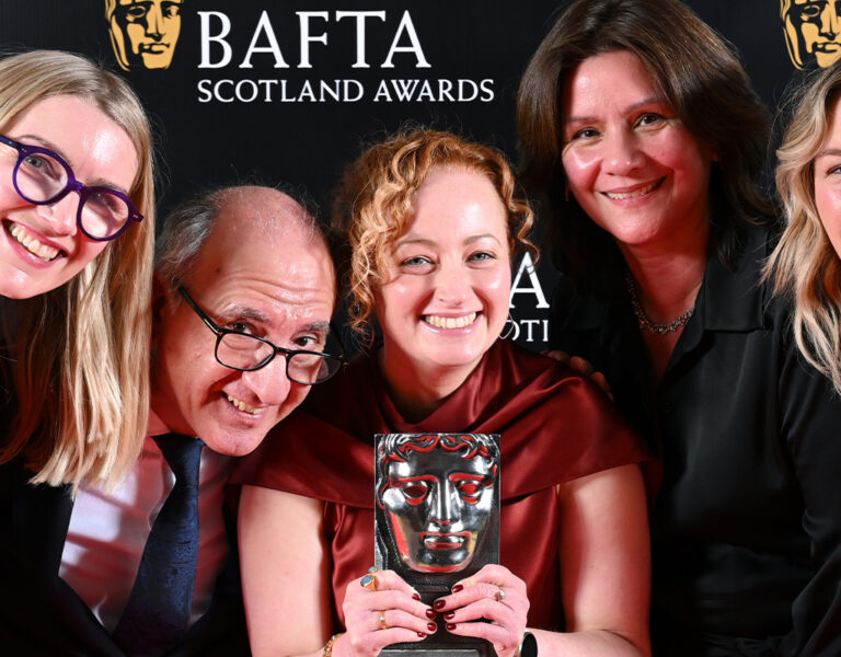 Armando Iannucci (2L) and guests pose with the Single Documentary Award for 'Imagine'