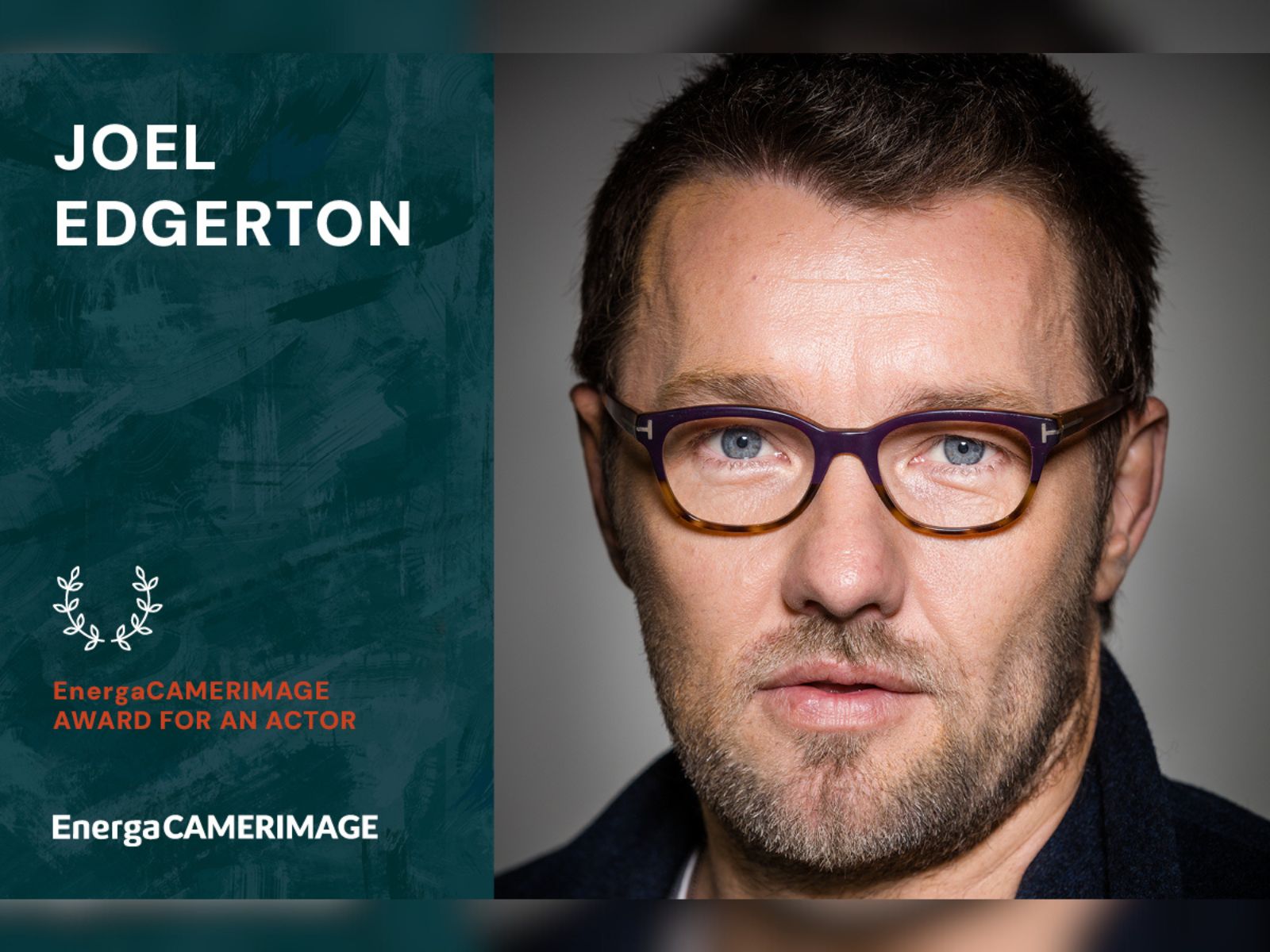 Joel Edgerton in glasses looking into camera