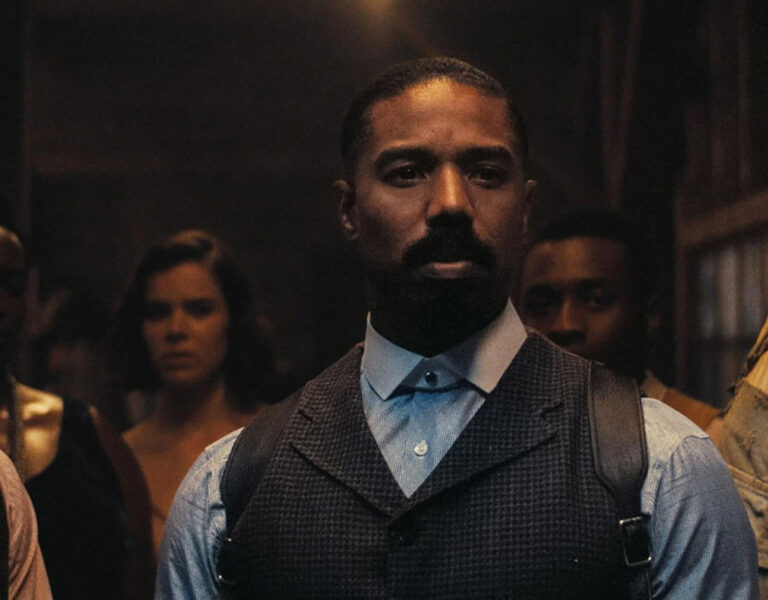 The cast of Sinners stood looking tense
