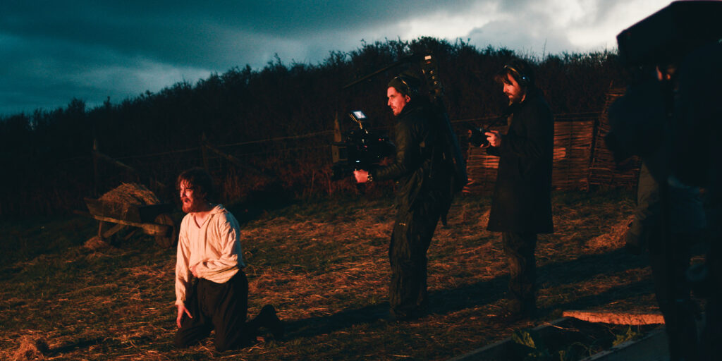 Butler and crew by the sea at night