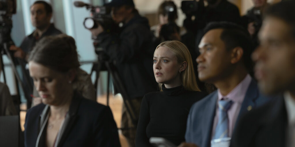 People sat at a press conference