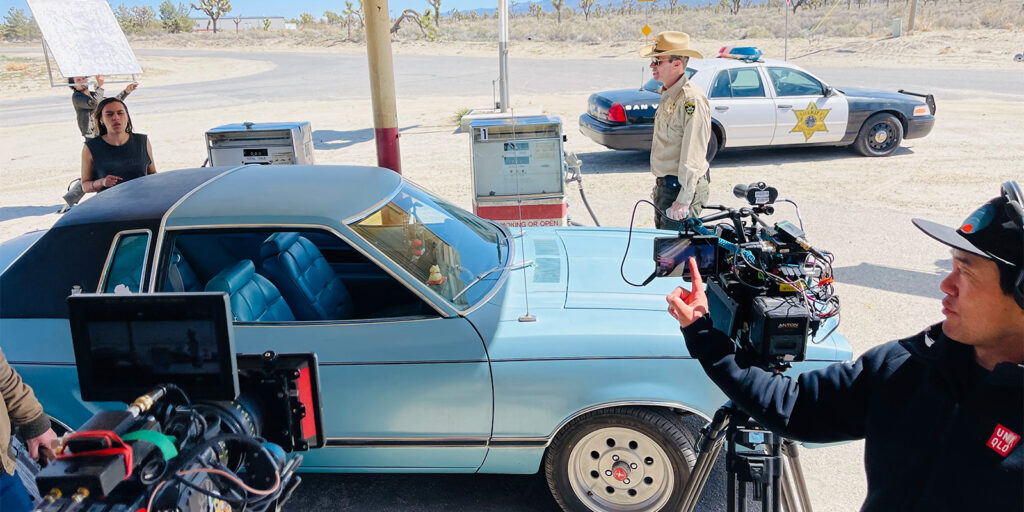 Film crew shooting a car