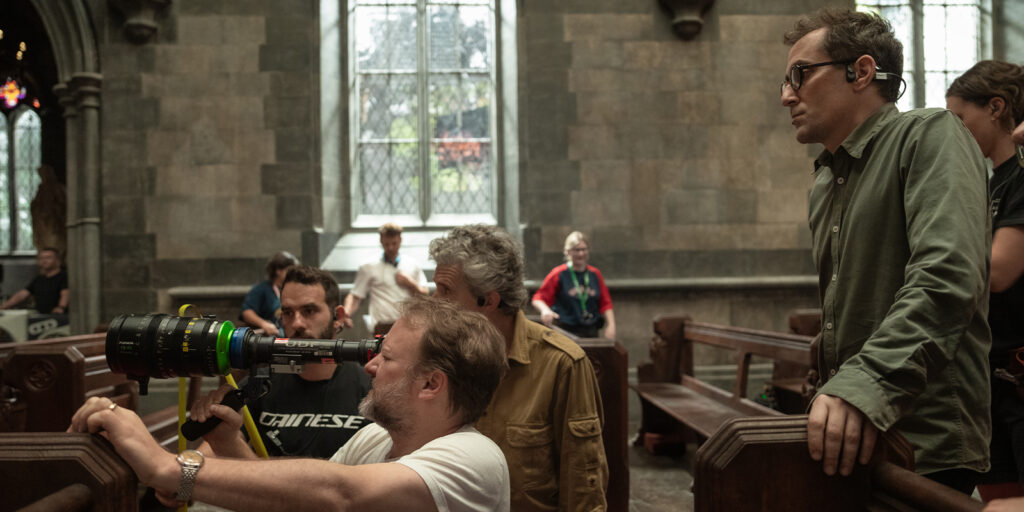 A film crew on set in church