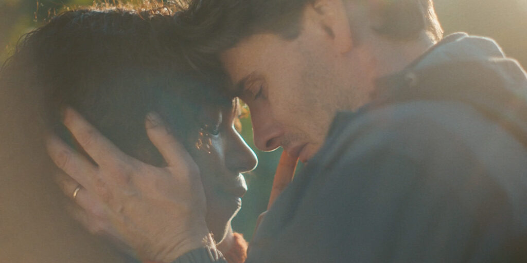 A man and woman embracing each other