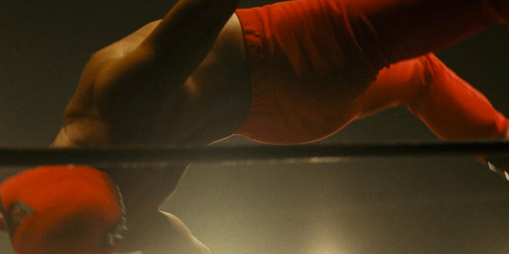 A wrestler mid backflip